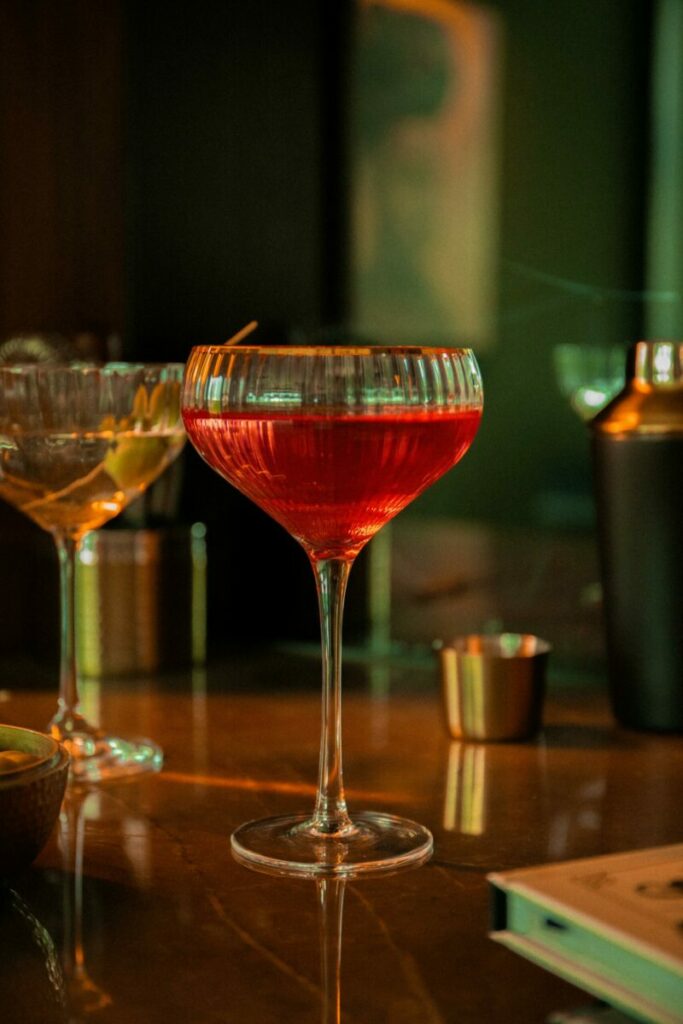 Stylish red cocktail on a bar counter, creating a retro vibe.